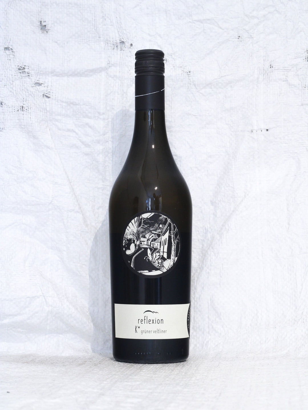 Grüner Veltliner Reflexion K 2024 von Johannes Zillinger, biodynamischer Biowein aus dem Weinviertel, minimalistisches weißes Etikett.