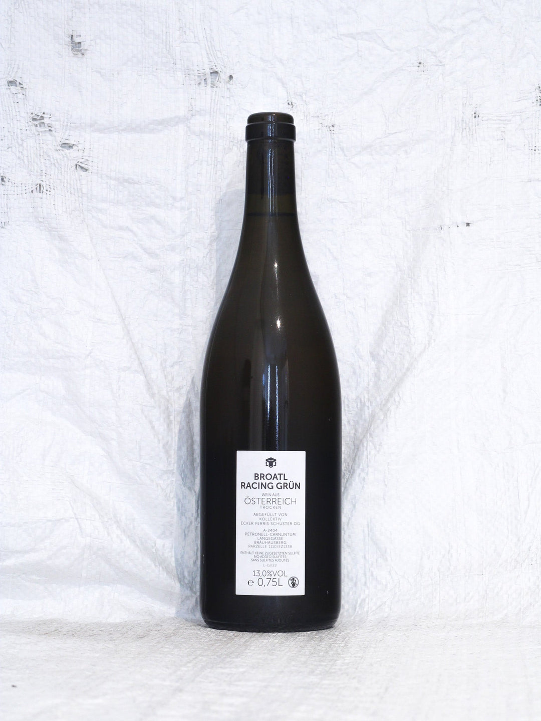 Rücketikett Broatl Racing Grün 2022 vom Kollektiv Peternell mit Details zu unfiltrierter Abfüllung, biologischem Anbau und Herkunft Österreich.