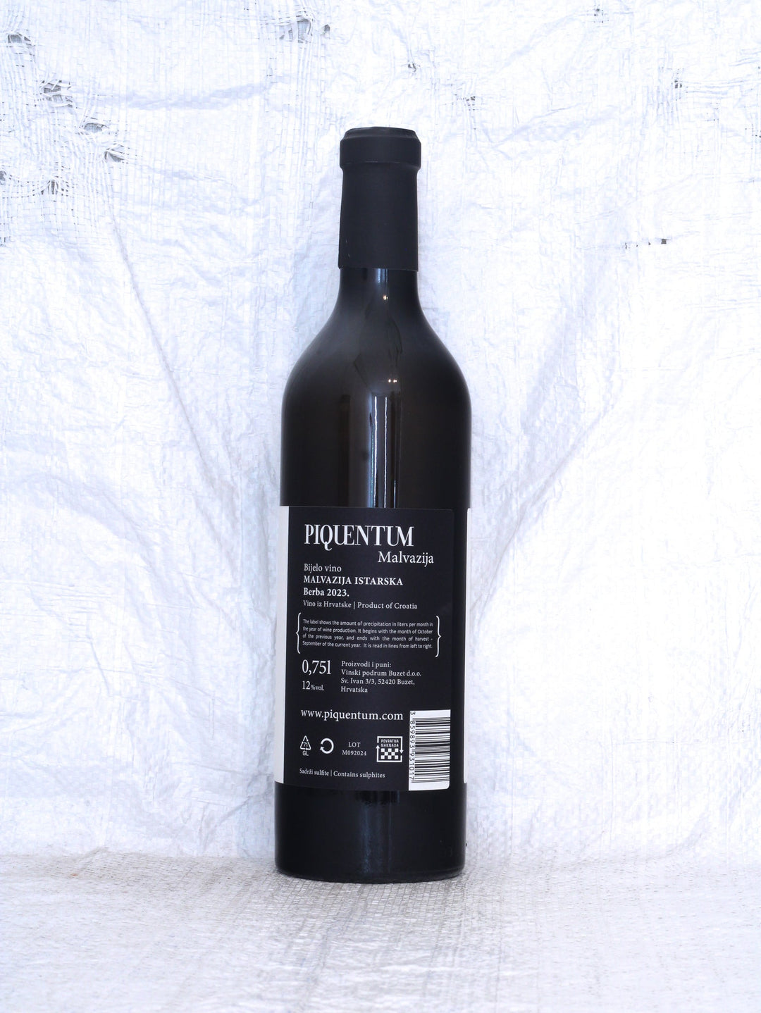 Rücketikett des Malvazija 2023 von Piquentum. Details zur Herkunft Istrien (Istra), Weinbau durch Dimitri Brečević in Buzet, spontane Gärung mit weineigenen Hefen und Informationen zur naturnahen Weinbereitung.